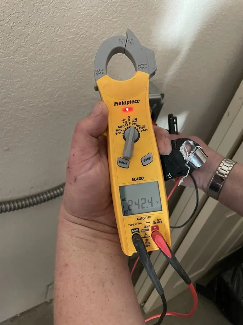 Voltage testing with clamp meter during Whole House Surge Protector in North Potomac